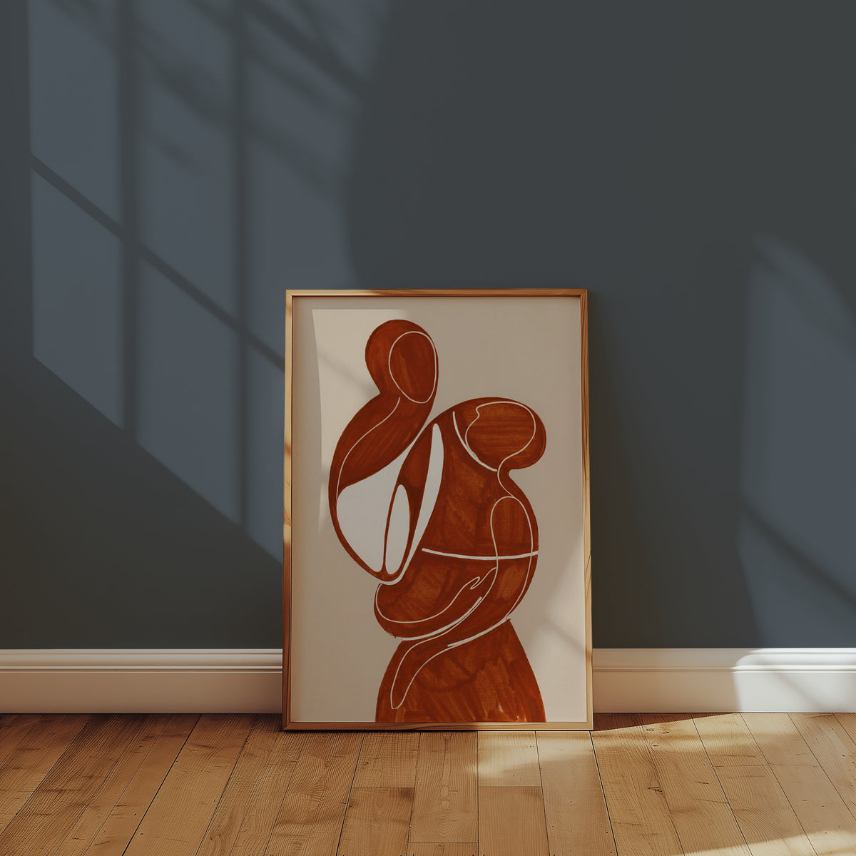 Terracotta Embrace Poster inramad ovanför en byrå i varm heminredning